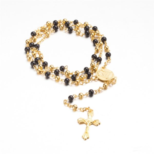 Chapelet catholique en métal à perles noires et dorées.